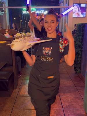 A post by @eltorocapecoral on TikTok caption: La mama de la mama @Selene Gala🌜 😮‍💨✈️ Come dance with us 💃🕺:📍3015 SW Pine Island Rd #117, Cape Coral, FL 33991 USA  • #viral #fyp #trend #trending #dance #airplane #elalfa #dembow #lamamadelamamaelalfa #vibe #restaurant #foryoupage #capecoral #swfl #miami 