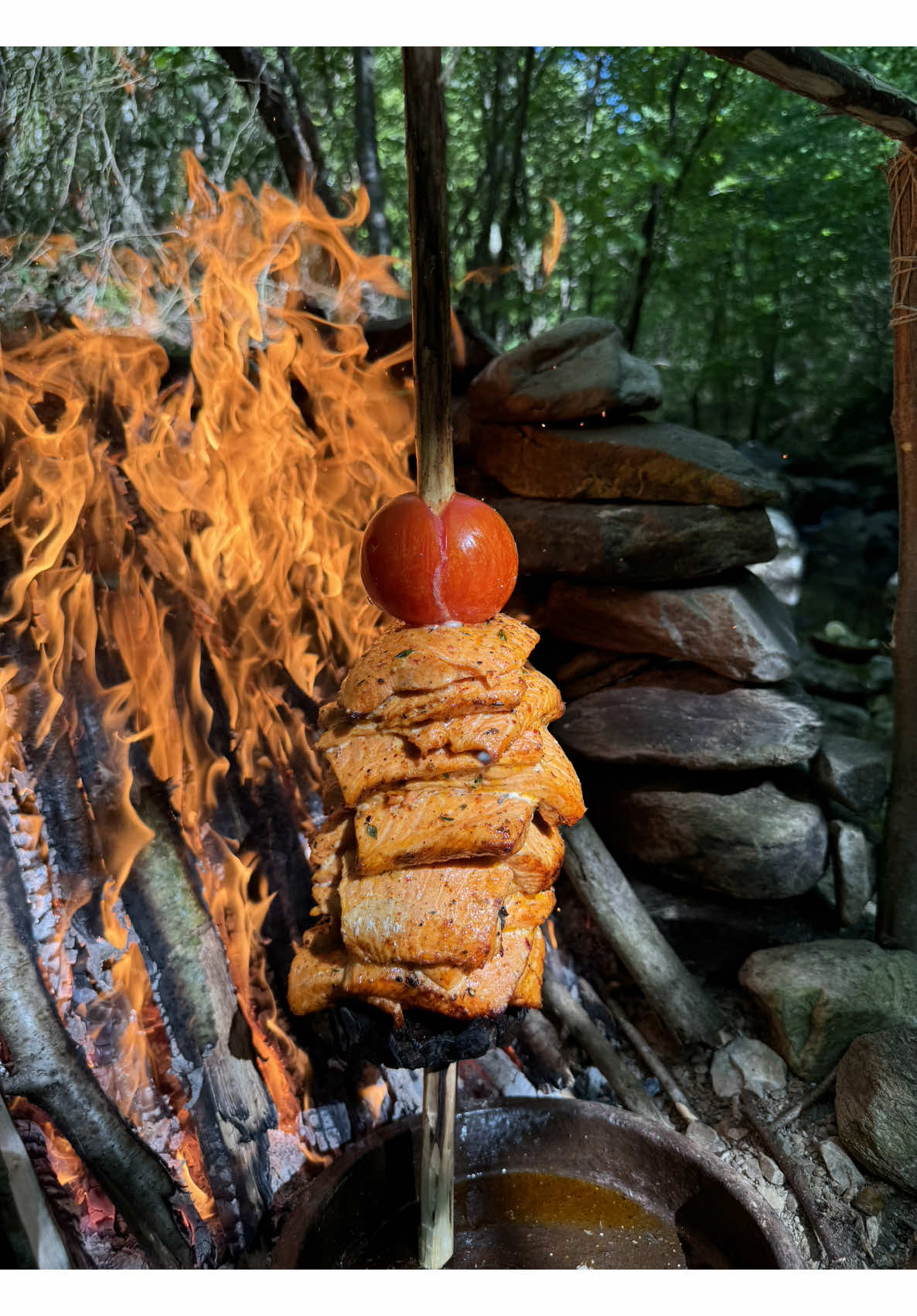 A post by @karadenizli.maceraci on TikTok caption: Doğal Taş Ocakta Somon Döner 🍣 Cooking salmon doner on a natural stone stove  #outdoorcooking #outdoors #foodvideos #asmr #cooking #asmrcooking #asmrvideos #foodporn #camping #cookingoutdoors #recipe #yemektarifleri 