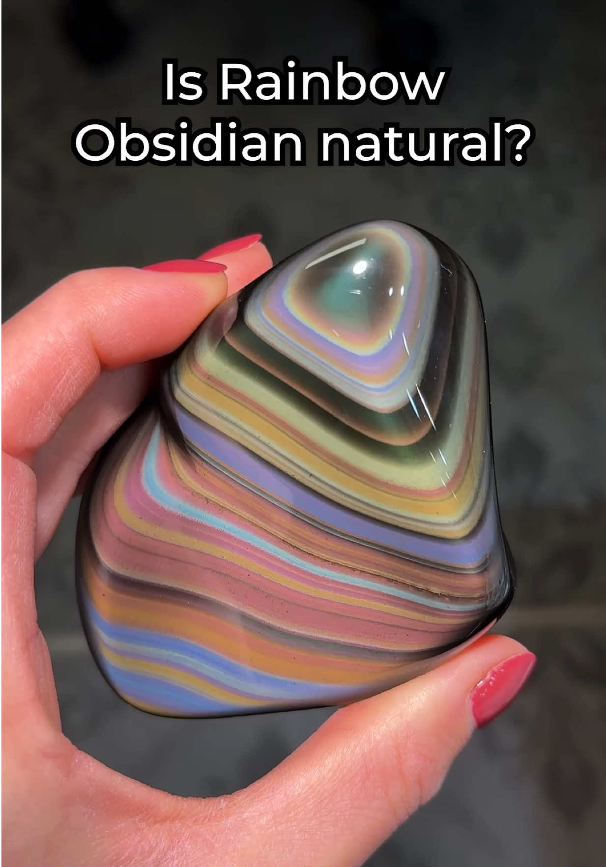 A post by @rocksforthespiritt on TikTok caption: Is Rainbow Obsidian Natural?🌈🤔