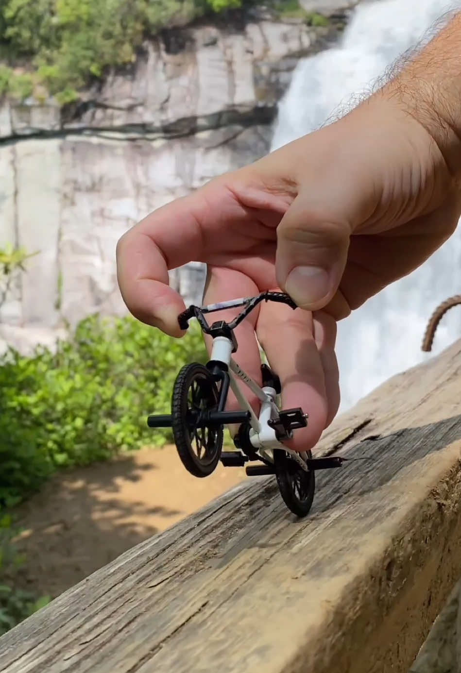 A post by @stonedboarder on TikTok caption: Waterfall view ✌️ #fingerbmx #bmx #techdeck #relaxing #bmxtricks #bmxlife #mini #fingerbike #chill #fyp 