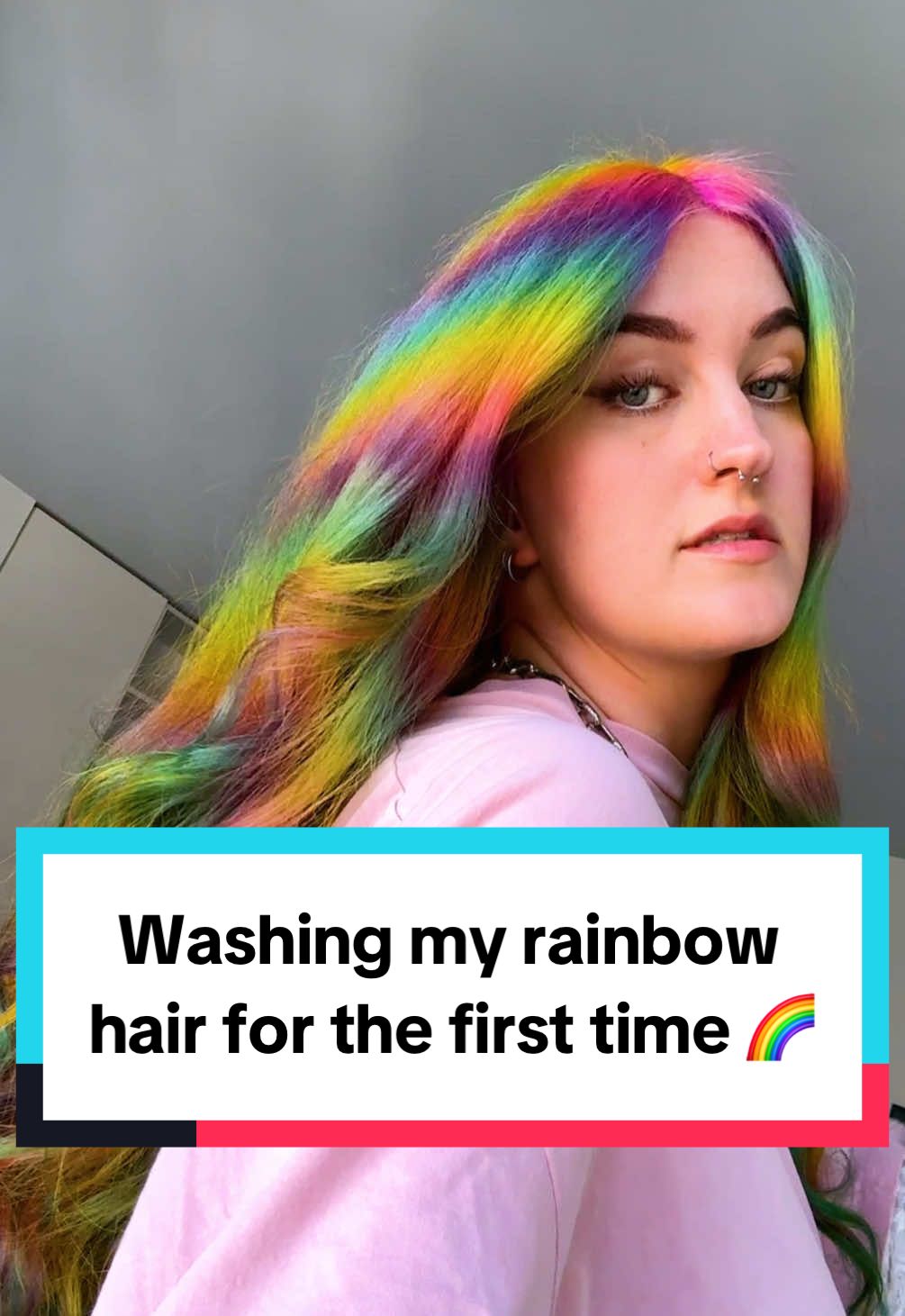 A post by @kellylouisekilljoy on TikTok caption: Let’s see how my rainbow hair will fade after the first hairwash! 🌈 #hairtransformation #rainbowhair #eurovision2025 