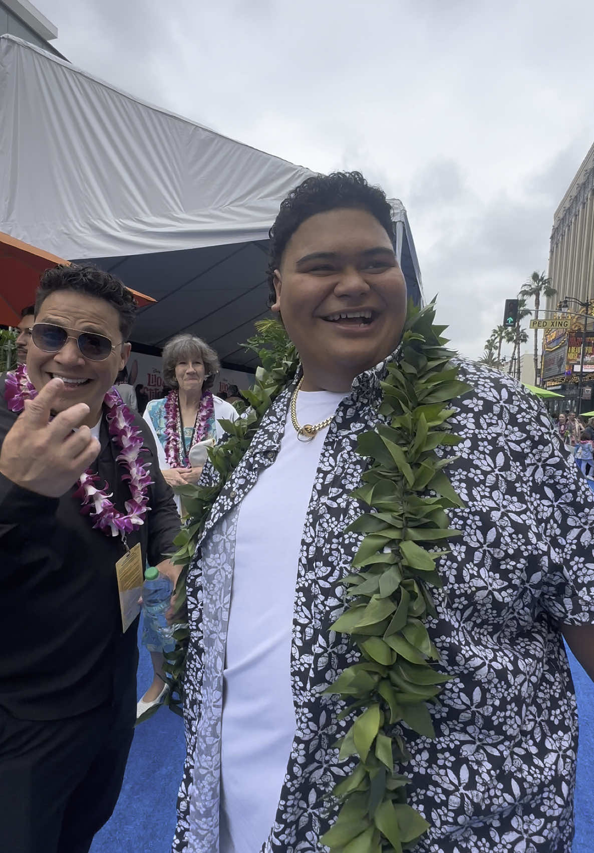 A post by @wtongi on TikTok caption: When you’re at a red (blue) carpet world premier event in Hollywood and they’re playing your song!  🤙🏽☀️ #liloandstitch 