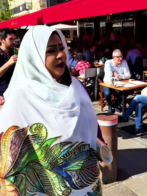 A post by @kawtherabdalla46 on TikTok caption: ماما كوكي بالثوب السوداني في مهرجان كان السينمائي : أنا سودانية.. أنا شموخ نخل الشمال وجبل توتيل!