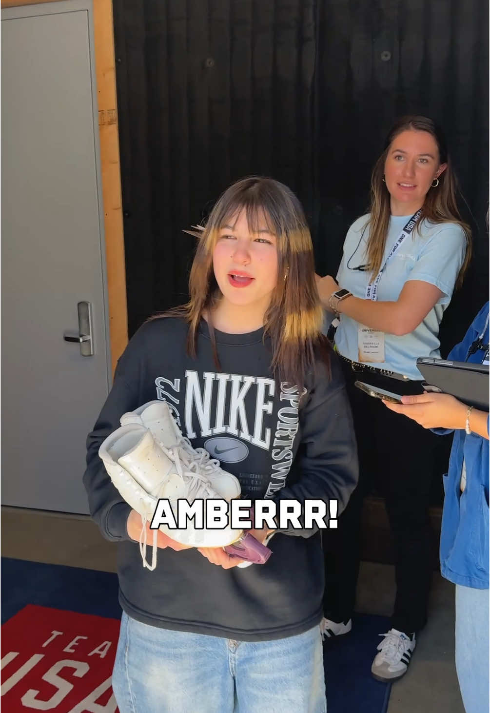 A post by @teamusa on TikTok caption: Sharing intel between sets 🤞 #teamusa #figureskating #alysaliu #amberglenn #winterolympics #behindthescenes 