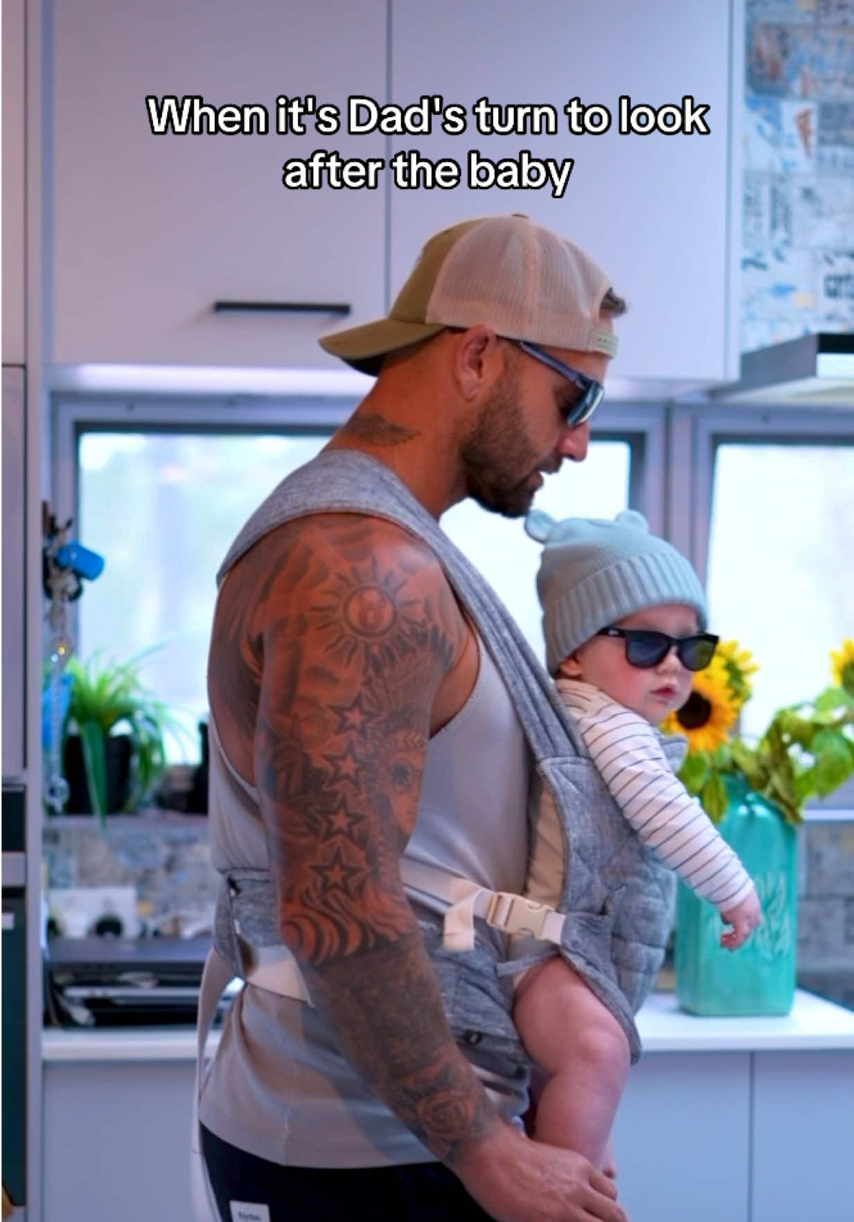 A post by @joelbushby on TikTok caption: As soon as I put the carrier on you should see how excited Riv gets 🤣 #DaddyDayCare #dance #fitDads 