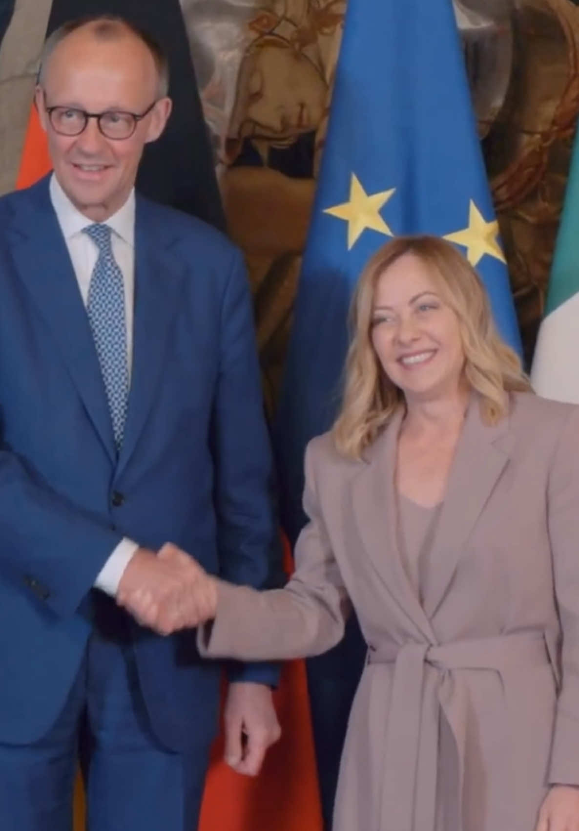 A post by @patrioti_giorgiameloni on TikTok caption: President Meloni receives German Chancellor Friedrich Merz 🇮🇹🤝🇩🇪  #giorgiameloni #friedrichmerz #italy #germany #fyp 