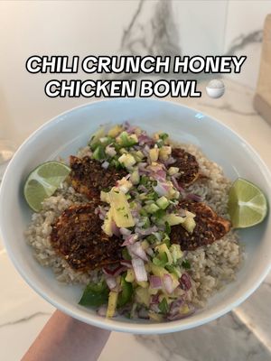 A post by @rhegancoursey on TikTok caption: Chili crunch honey chicken bowl recipe:  - preheat oven to 380 degrees  - coat chicken breast with olive oil, salt, pepper, paprika, garlic powder, chili powder or oil, and honey  - put chicken in the oven for 20-25 minutes  - put together pineapple salsa with: diced red onion, cilantro, pineapple, jalepeno, salt, pepper, and the juice of 1 lime - give it a mix  - plate with: choice of rice, chicken on top & pineapple salsa - drizzle honey on top - enjoy!! 
