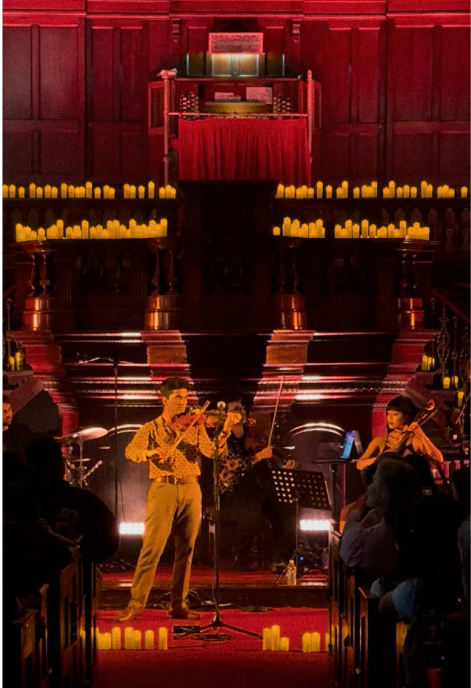 A post by @joelsvnny on TikTok caption: codex in sydney 📖 thinking of doing more shows in my home country this year. Also how beautiful is this venue - I almost want to write volume 3 about it… 🕯️ #codex #throneofglass #editaudios #BookTok #marvel #fyp #indianviolin #xyzcba
