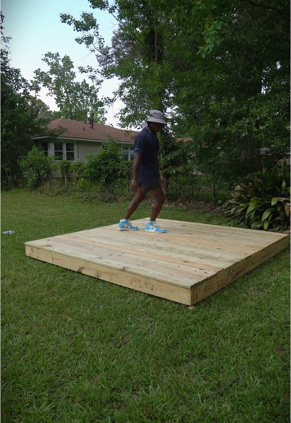 A post by @unclejhonn on TikTok caption: videos always make the work look easy. #Deck #DIY 