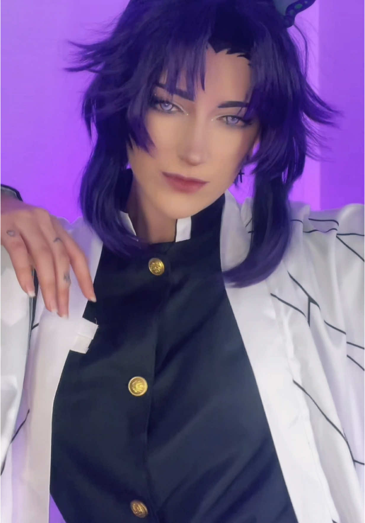 A post by @.ayoitslani on TikTok caption: Unexpected but I styled this wig like 10 months ago and I wanna start doing demon slayer again cause I miss it 👹 #demonslayer #cosplay 