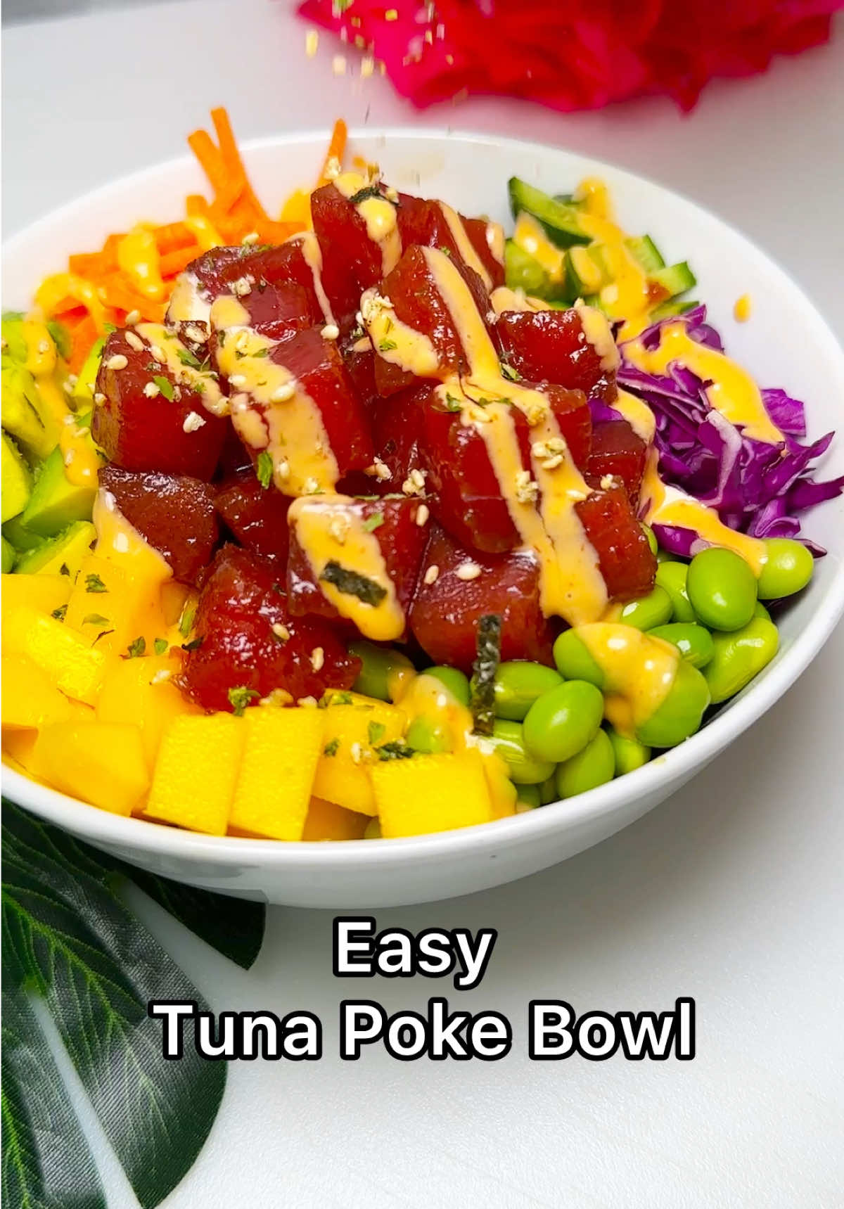 A post by @chefgenevieve on TikTok caption: Tuna Poke Bowls 🌺 Light, fresh, and full of flavor! These Tuna Poke Bowls are the ultimate healthy summertime meal. Ingredients: 8oz raw tuna (flash frozen or sashimi grade) 2 Tbsp soy sauce 1 tsp rice vinegar 1 tsp honey  1 tsp sesame oil 1 tsp sriracha  Thaw tuna in fridge. Slice into bite sized cubes. Add all remaining ingredients, mix well. Cover and allow to marinate (20 minutes) Meanwhile, prepare your toppings: 1/2 cup sliced cucumbers 1/2 cup shelled edamame  1/2 cup shredded carrots  1/2 cup diced mango 1/2 cup diced avocado 1/2 cup shredded purple cabbage Prepare 2 cups steamed rice and season. Divide rice into 2 bowls and add your toppings then spoon on the tuna and poke sauce.  Optional: Top with spicy mayo (recipe below) and furikake seasoning.  Spicy mayo: 1/4 cup kewpie mayo or regular mayo  1 tbsp sriracha  1 tsp rice vinegar  1/2 tsp sesame oil Water for thinning #tunapokebowl #healthyrecipes #summerrecipe #lightmeal #poolsiderecipes