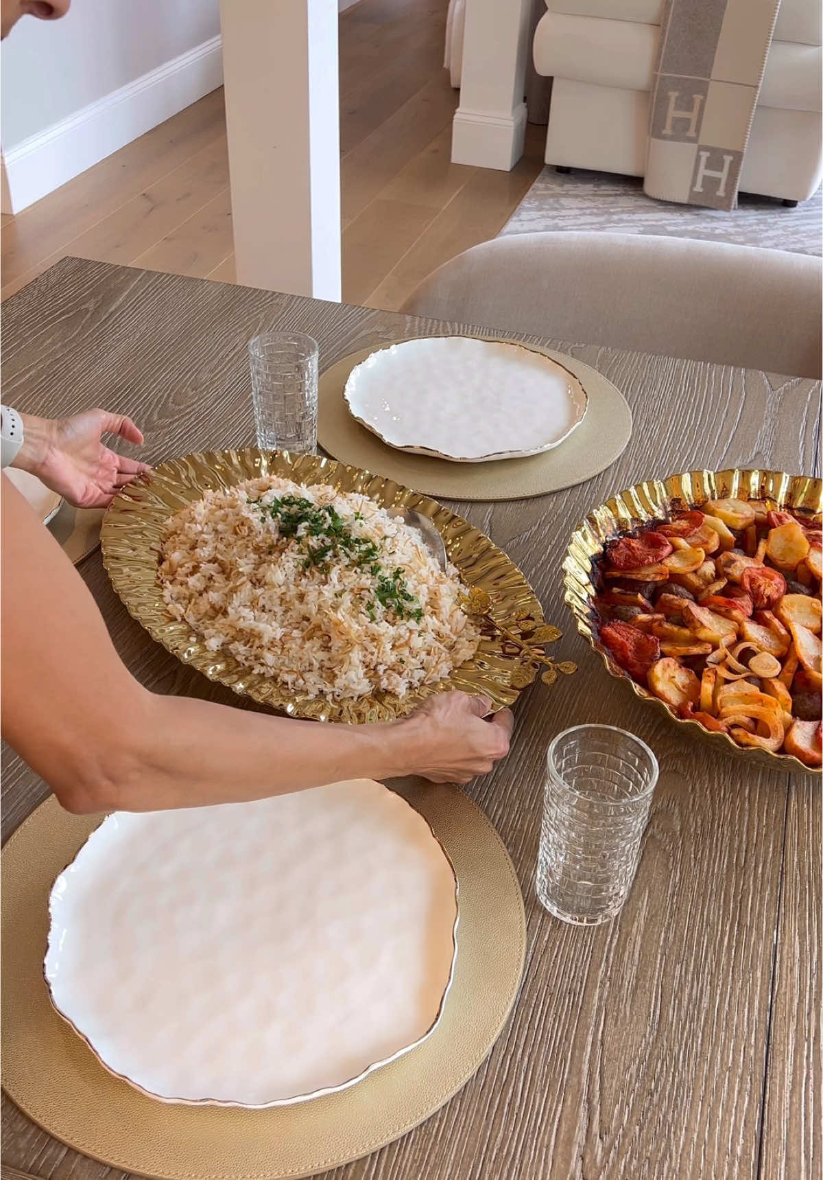 A post by @homewithfarah on TikTok caption: Make dinner with me using my favorite Serveware set from Pampa Bay. Get 20% off sitewide with code Farah20  from the link in my bio or http://www.pampabay.com/farahpb ! Can you believe they are dishwasher and oven safe? Looks like metal but is porcelain! Made “ Kafta Bil Souniye” Lebanese version of Kafta, potatoes, tomatoes and onions in tomatoe sauce and baked in the oven❤️