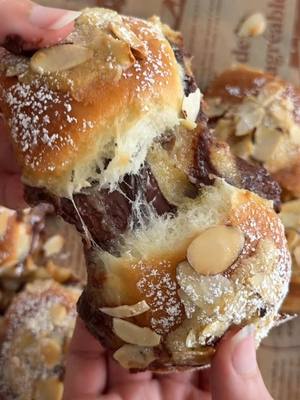 A post by @moribyan on TikTok caption: 🥐 Chocolate Almond Croissant Rolls! Recipe up on the blog as always at www.moribyan.com - link in bio 🤎