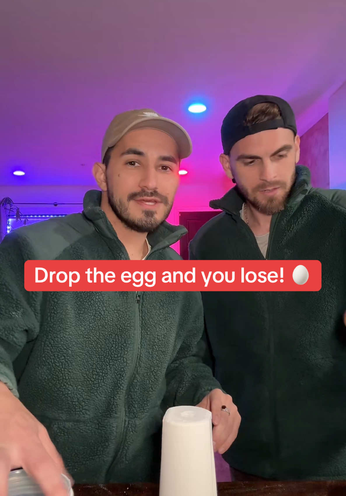 A post by @whenericmetseb on TikTok caption: Drop the egg and you lose challenge 🙅🏻‍♂️🥚@Sebastian 🦀 @Eric Flick 🤴🏻 #couple #viral #fyp #relationshipgoals #tiktokchallenge #trends #couplegoals #games #lgbt🌈 #lgbt🏳️‍🌈 #tiktoktrend 