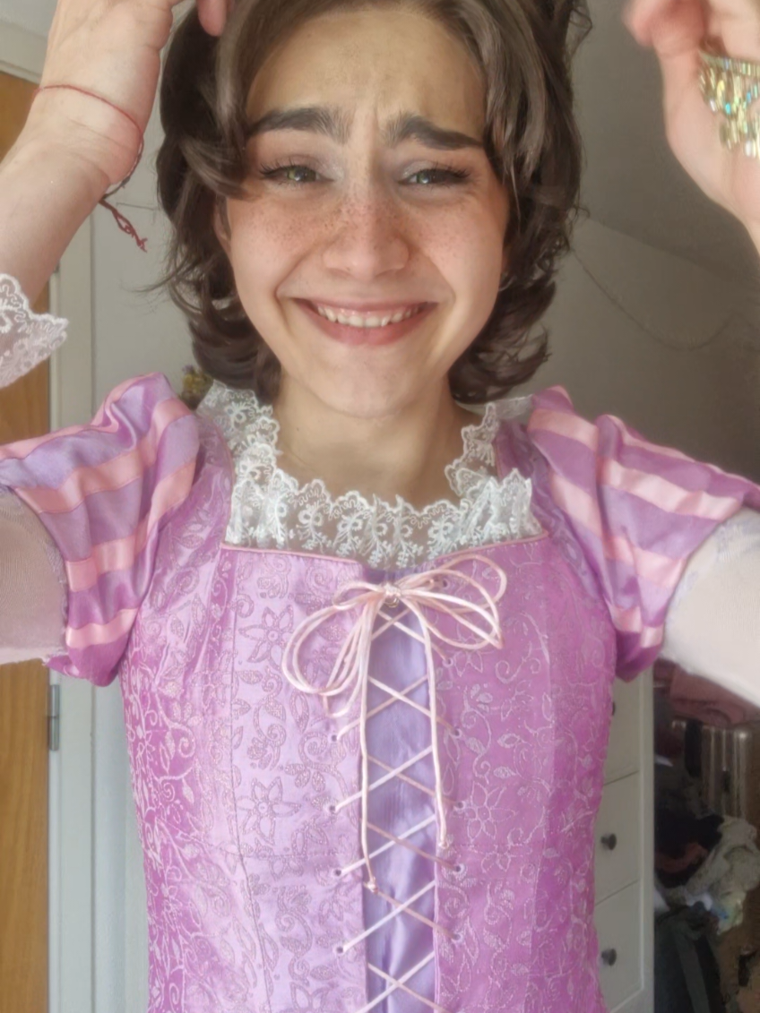 A post by @whatabout4ndy on TikTok caption: turn to dust for all I care #rapunzel #rapunzelcosplay #tangled #tangledcosplay 