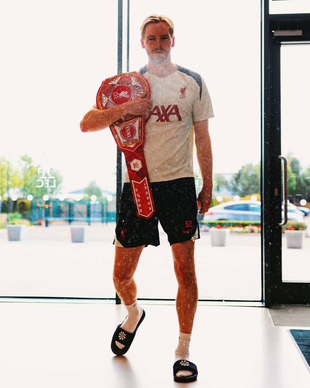 A post by @liverpoolfc on TikTok caption: #LFC x @WWE 💪