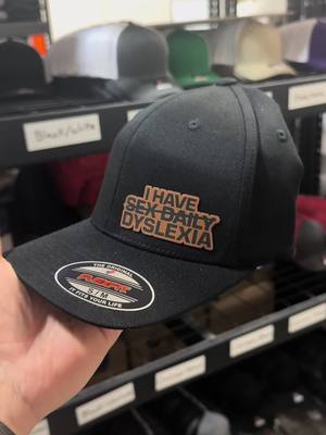 A post by @customgrainsmn on TikTok caption: Who needs this hat? #lol #dyslexia #lolz #funny #hats 