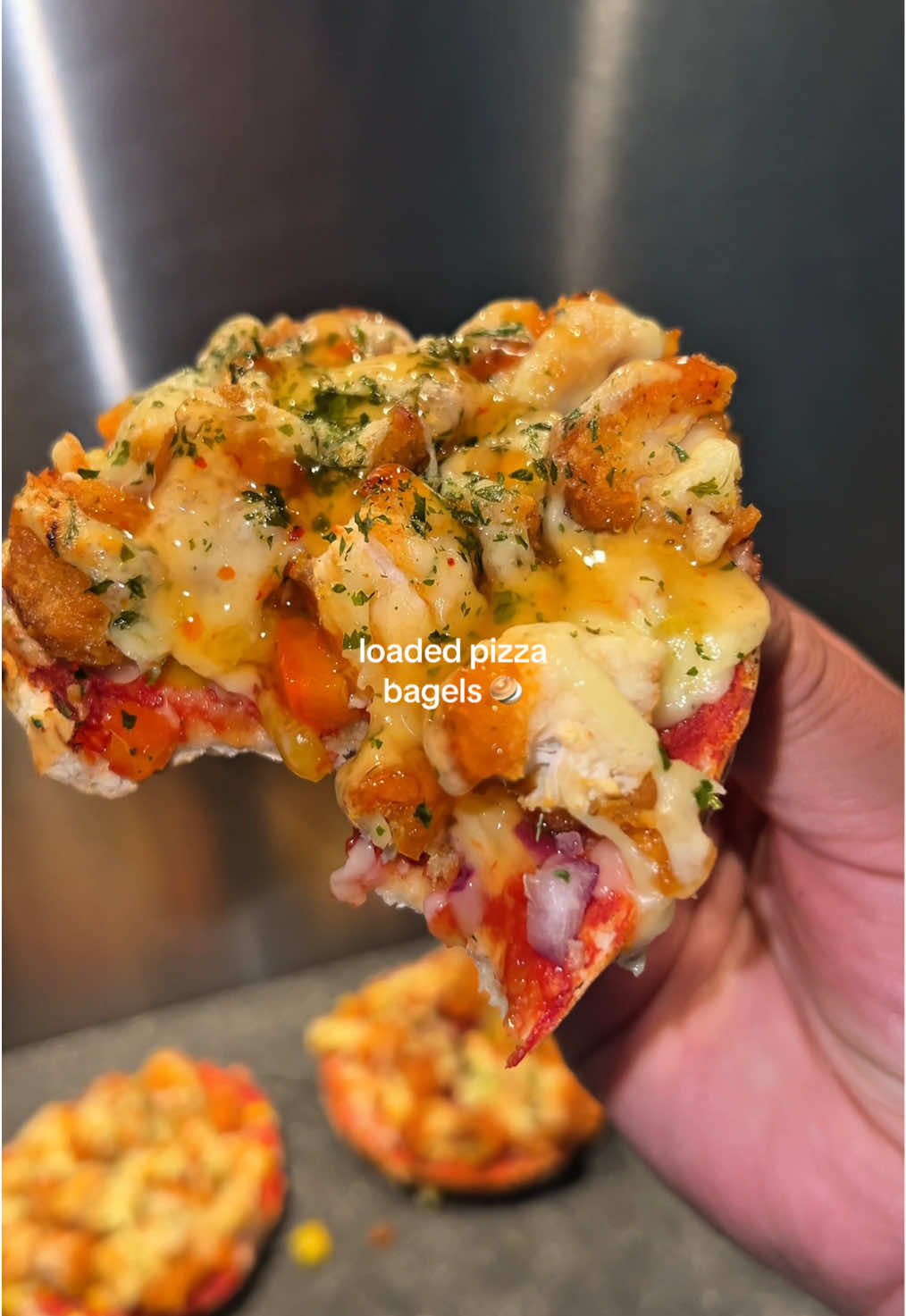 A post by @shezcooks on TikTok caption: 30 Minute Loaded Bagels 🥯  The chicken bites I used are from @Barakah Bites UK  You can find them in the freezer section of your local south Asian store, or online 💛 If you want 10% off you can use the code ‘ ShezCooks’ at checkout 💰 #bagel #bagelrecipe #pizzabagels #EasyRecipe #quickrecipes #30minutemeals #FoodTok #Recipe #cooking 