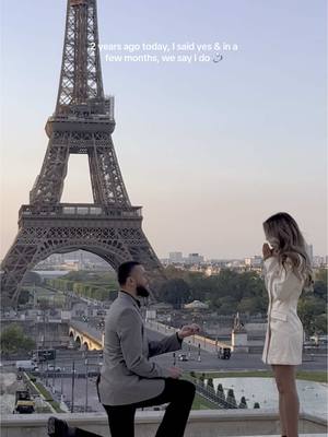 A post by @elainamich on TikTok caption: Can’t believe this was 2 years ago 🤍🥹 only a few months until our wedding day 💍 #engaged #wedding #bride #paris #weddingtiktok #bridetobe #weddings #bridal #engagement 