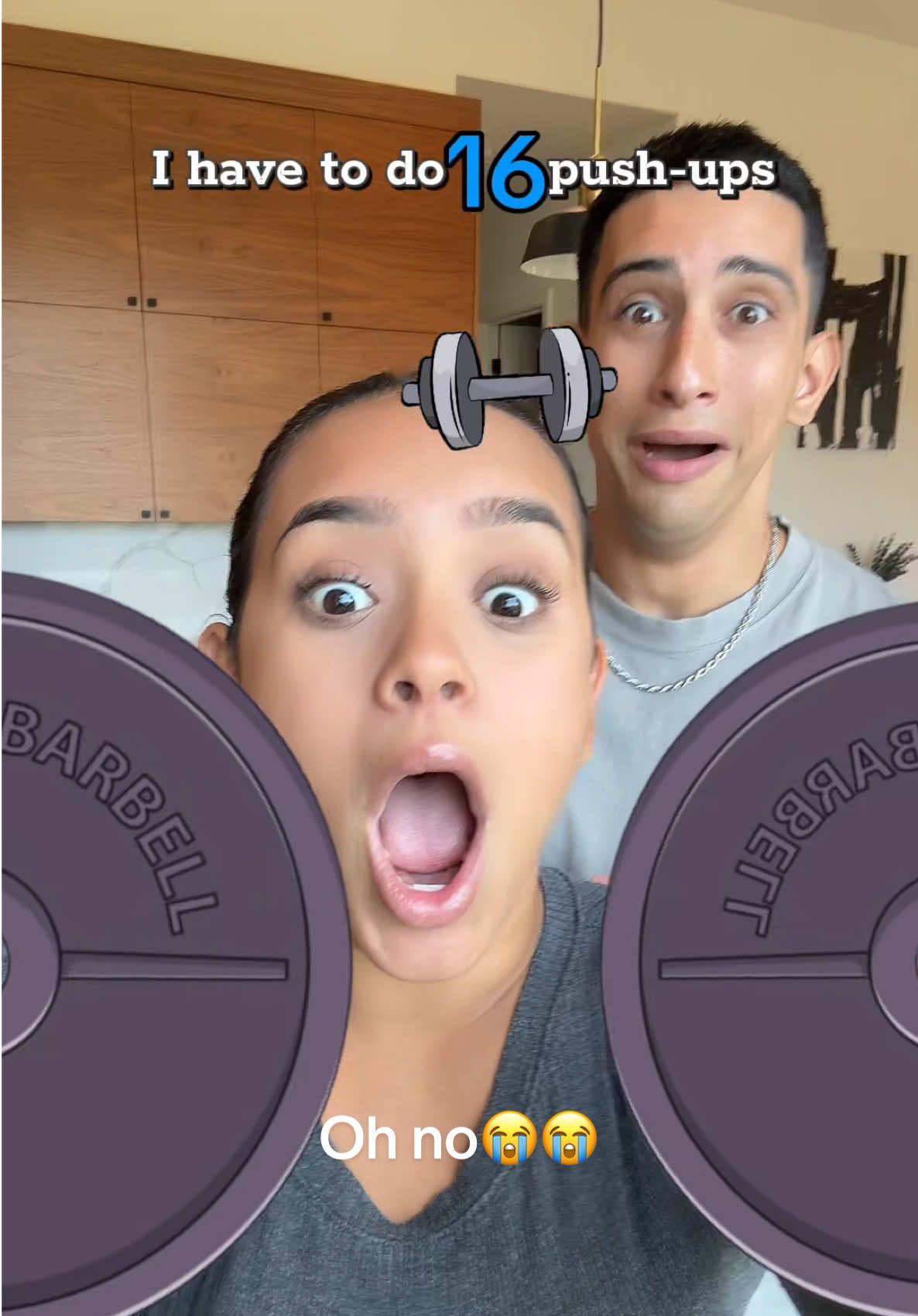 A post by @isaacandandrea9 on TikTok caption: How many push ups do you have to do?😂 #viral #couple #fyp 