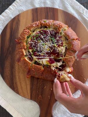 A post by @spanglishfashion on TikTok caption: Brie baked bread with cranberries ✨ Ingredients: - bread - Brie cheese - Cranberries sauce - Mozzarella slices - Parmesan cheese - Lemon - lemon zest Take to oven on 380 degrees for 20 mins  #cranberry #cheesyfood #cheesy #cheesybread #homecooking #foodie #foodiegram