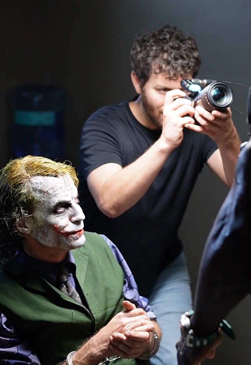 A post by @alex.stemp on TikTok caption: Filming a DC style movie trailer… I’ll be posting results soon! 🎬 @ChefRush @Agentᔕ Of ᛕhaoᔕ 🃏 #Cinematography #DCStudios #DCComics #Fanfiction 