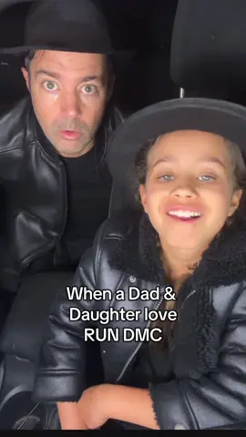 A post by @benandzara on TikTok caption: It’s Tricky to find a fedora small enough to fit Zara! #rundmc 