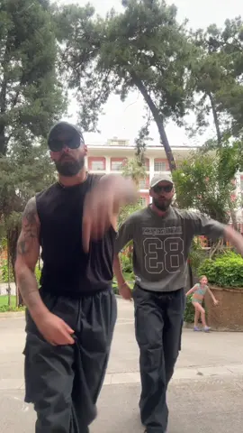 A post by @twincity on TikTok caption: Let’s go @mgk ✊🏻 Cliche 🔥  #twins #dance #fyp #dance #trending 