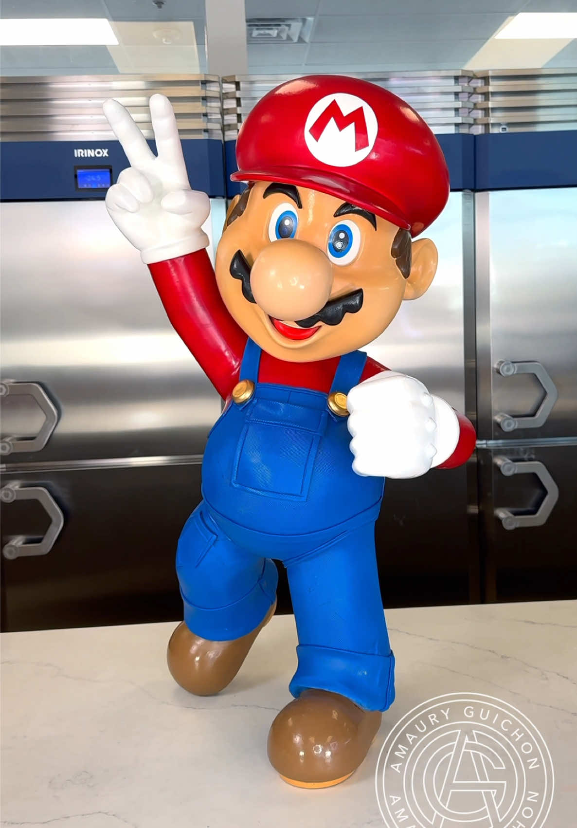 A post by @amauryguichon on TikTok caption: It’s-a me! Amaury! 🍄 A closer look at the making of our favorite chocolate plumber! #amauryguichon #chocolate #mario 
