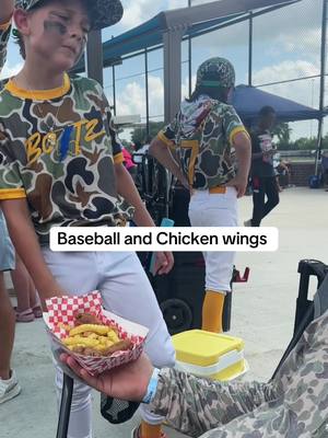 A post by @wrenandemmesworld on TikTok caption: Two of Wrens favorite things 😂⚾️🍗 #wrendavid #baseball #baseballboys #fyp #momtok #savannahbananas #catcher #baseballszn #baseballlife #foryou #momlife #ballpark #dance #funtimes 