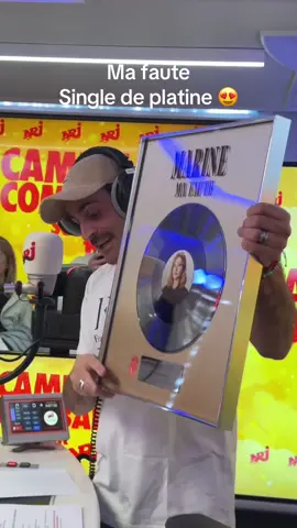 A post by @marinedmusique on TikTok caption: Camille Combal m’a remis mon disque de platine pour Ma faute en direct sur NRJ 🥹 Merci 🫶🏼