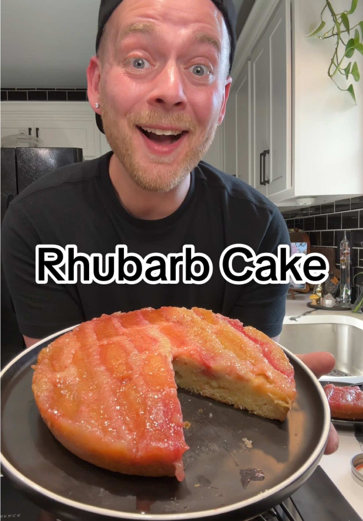 A post by @kitchentool on TikTok caption: Replying to @Lovina Rhubarb upside down Cake is the only reason you need to grab a bundle 😁 Sticky, buttery, and secretly easy, Just wait for the flip #RhubarbSeason #UpsideDownCake #SpringBaking #DessertTok #CakeFlip #BakingFromScratch #EasyDessertRecipe #ViralBakes #FoodieFinds #TikTokBakes #illbakeyouhappy #BakeWithMe #HomemadeDessert #RhubarbRecipes #try #fyp  Rhubarb Upside-down Cake  5 Rhubarb stalks  1/3 C. Sugar  Cake: 3/4 C. Sugar  1/4 C. Butter (melted)  2 Eggs  1 tsp. Vanilla  1/2 C. Milk  1 C. Self-rising Flour  Clean and cut rhubarb to fit pan. Lightly grease pan. Evenly spread 1/3 cup of sugar on the bottom then place rhubarb round side down.  To make the cake mix together sugar and butter, then mix in egg, vanilla, and milk, lastly mix in flour til batter is smooth. Pour batter over the rhubarb and bake at 350°F for 45-50 minutes.  Let cake cool for 15 minutes.  Loosen the edges, Place a plate on top of pan and flip it over.  Slice and serve warm 