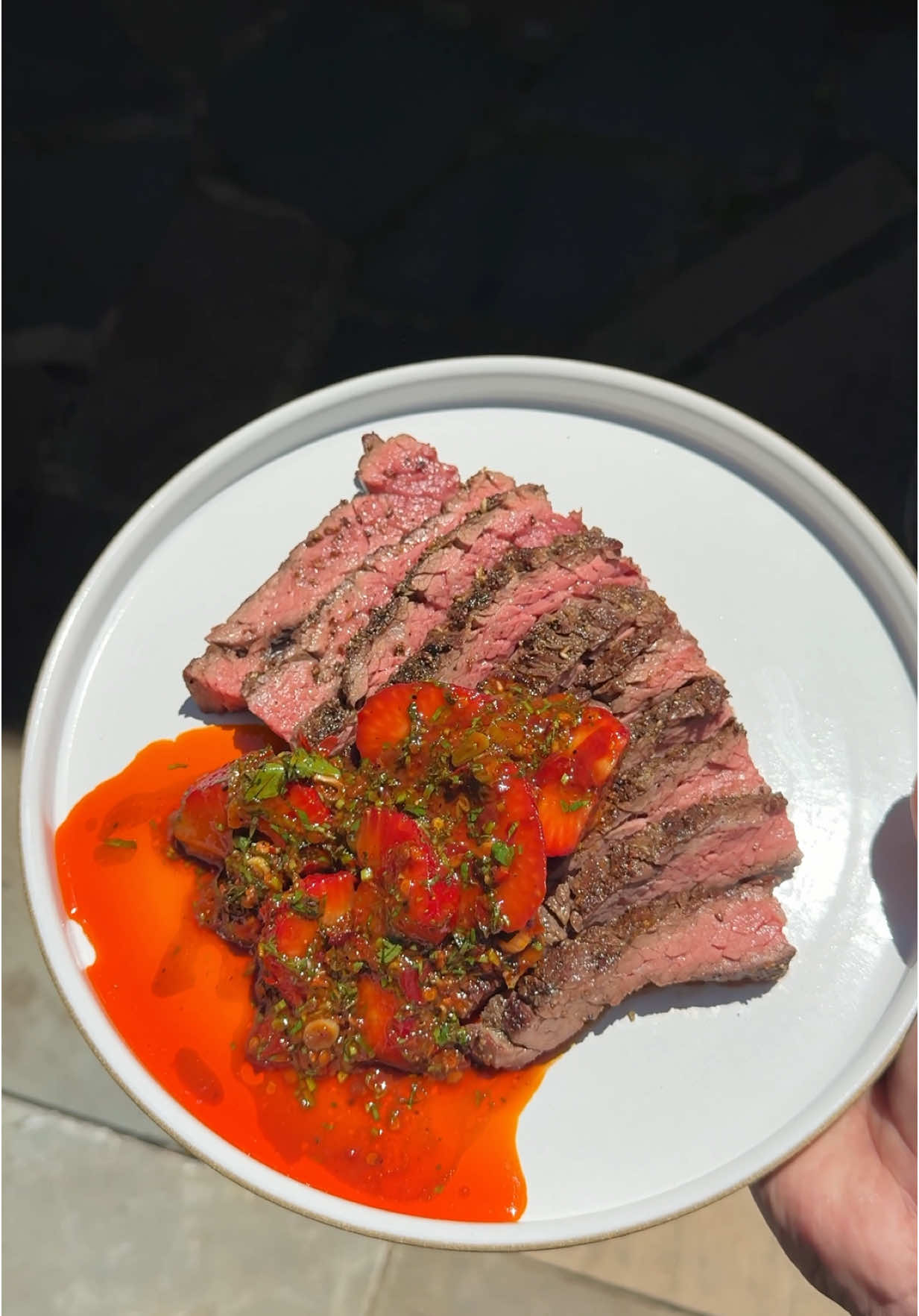 A post by @chuckischarles on TikTok caption: Grilled steak with strawberries and doubanjiang 