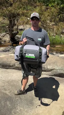 A post by @tylerbarnes_catfishing on TikTok caption: The 4REEL Fishing 40L Waterproof Duffle Bag is built for the toughest adventures—rain, river or road 