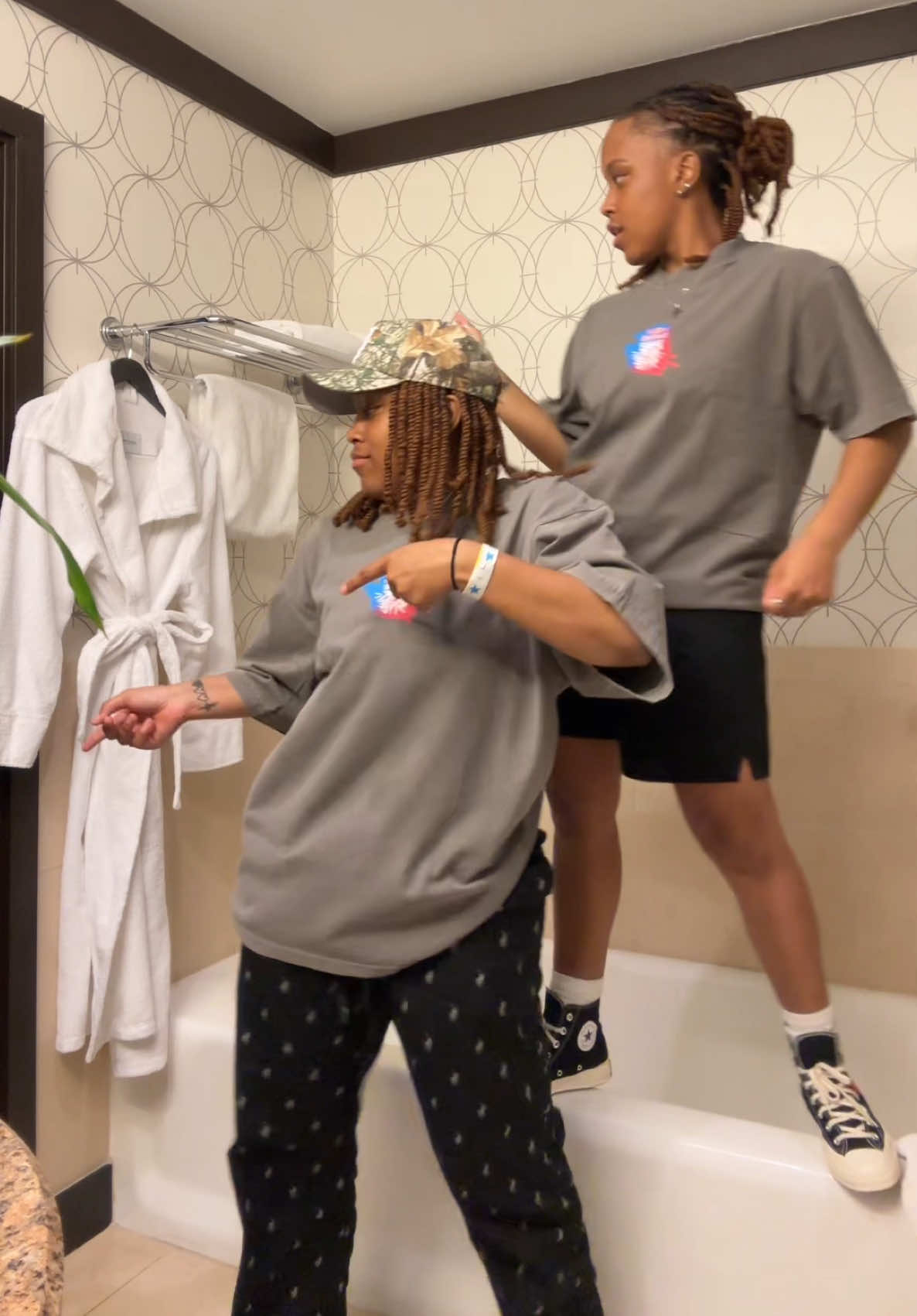 A post by @splashtwinz on TikTok caption: Idk why she’s dancing on the tub 🤣🤣🕺🏼 #foryou #twins 