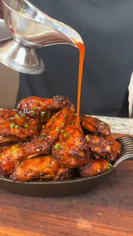 A post by @eatwitzo on TikTok caption: Its grilling season – and its my goal to get everyone cooking outside.  Welcome to part 1 of the Smoker Series: Honey Buffalo Smoked wings on my Searwood wood pellet grill!@Weber Grills #webergrills #woodpelletgrilling #woodpelletrecipes #smokedrecipes 