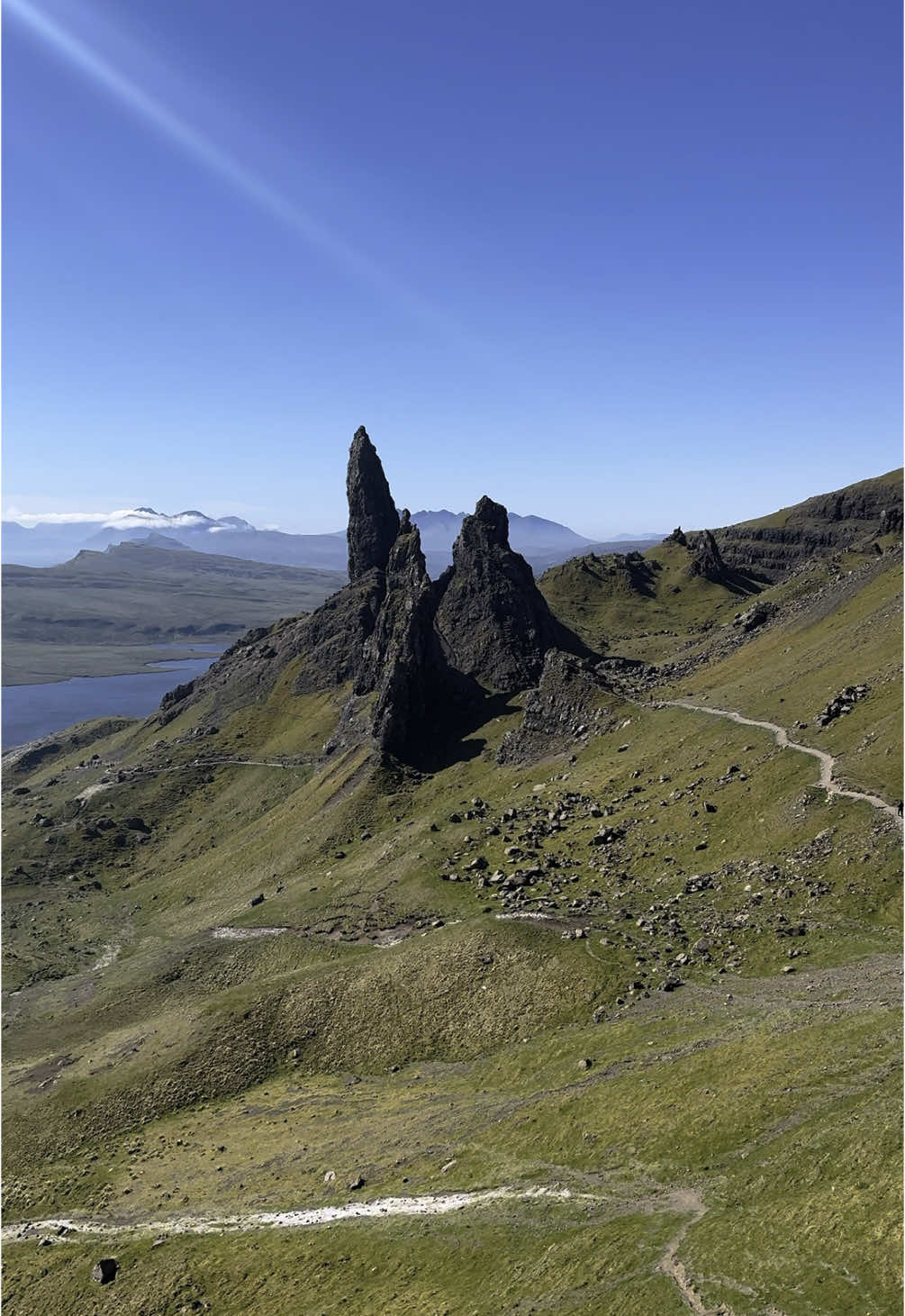 A post by @scotland_uncovered on TikTok caption: A rare sunny day in the Isle of Skye 😍🏴󠁧󠁢󠁳󠁣󠁴󠁿 #isleofskye #Scotland #oldmanofstorr 