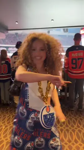 A post by @eliana.kalogeras on TikTok caption: ANOTHER OILERS W 🧡💙