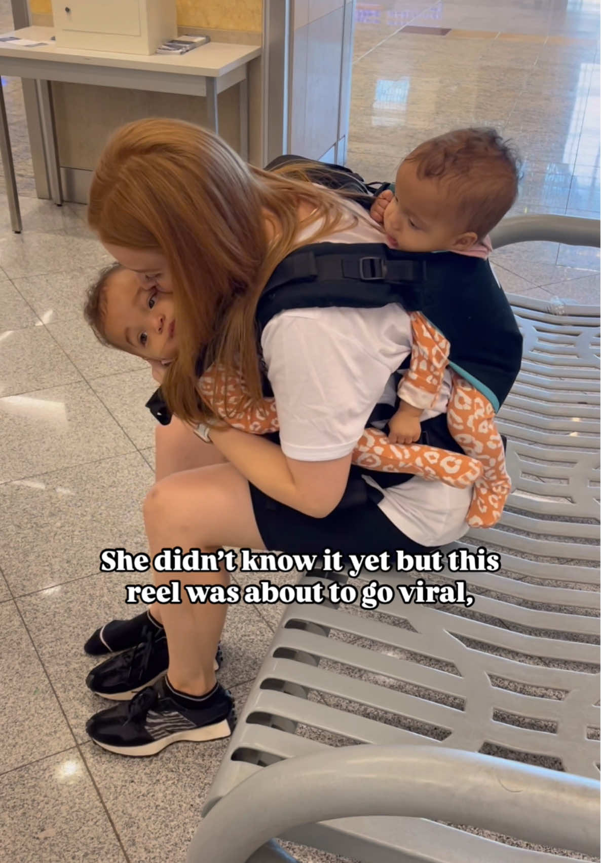A post by @jadeticer on TikTok caption: Little did I know I was the worst mum in the world… 🤦🏼‍♀️👇🏼 A. Because apparently the ‘poor’ baby on the back is left out.  and also B. Because I should’ve tied my hair up.  and lastly  C. I couldn’t possibly have flown solo for 9 hours from the 🇺🇸 to the 🇬🇧 because for the 15 second duration of this clip someone was with me filming. #travel #traveltok #familytravel #travelfamily #travellingwithkids #tandem #babywearing #mom #momtok #momcontent #twintok #viral #ditl #sahm #morningroutine 