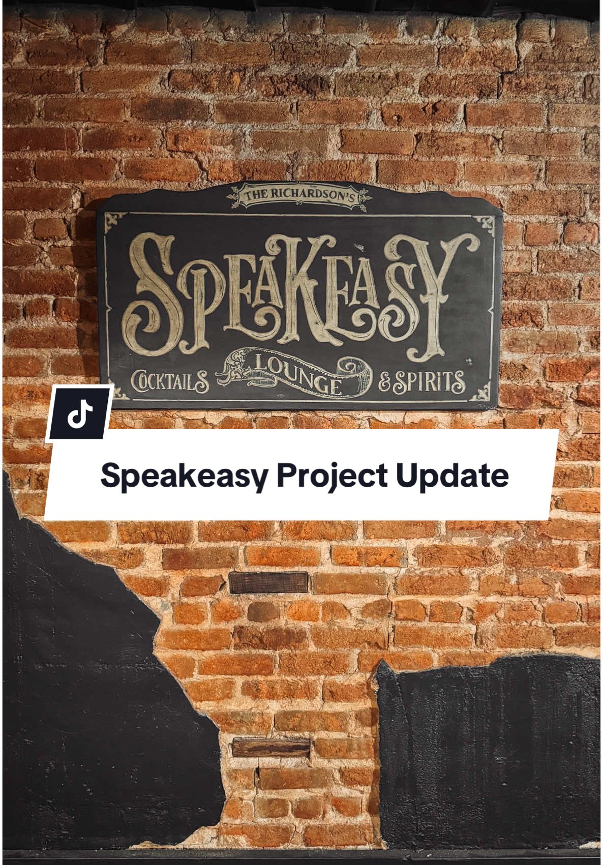 A post by @thecolorofourhome on TikTok caption: Speakeasy Project Update! Just because it’s been quiet doesn’t mean we haven’t been busy—there’s always magic happening behind the scenes. ✨ Here’s what’s new: • Beadboard is officially up on the walls • Plaster, beadboard, and ceiling tiles are fully painted • We scored the most incredible hand-painted speakeasy sign from @inked gaga 🎨 • Beautiful French doors are currently in the works Coming up next: • Restoring the original hardwood floors to their former glory • Adding trim to the walls and ceiling for that perfect finish • Bringing in a vintage bookcase to complete the vibe 📚 Stay tuned—and don’t forget to hit that follow button for more behind-the-scenes updates and reveals! #speakeasy #speakeasyproject #renovationseries #inprogress #hiddenroom 