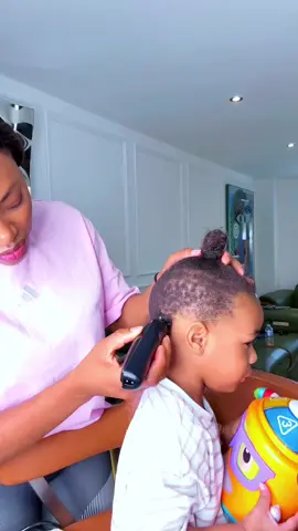 A post by @olivia_chukwu on TikTok caption: Giving Chiemeka a haircut #olivia_chukwu 
