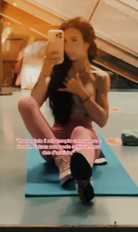 A post by @yelena_infernalfit on TikTok caption: Allenata dal fuoco, nutrita dalla volontà. Satana mi ha voluta crudele. E io ho detto: sia fatto.✔️ 