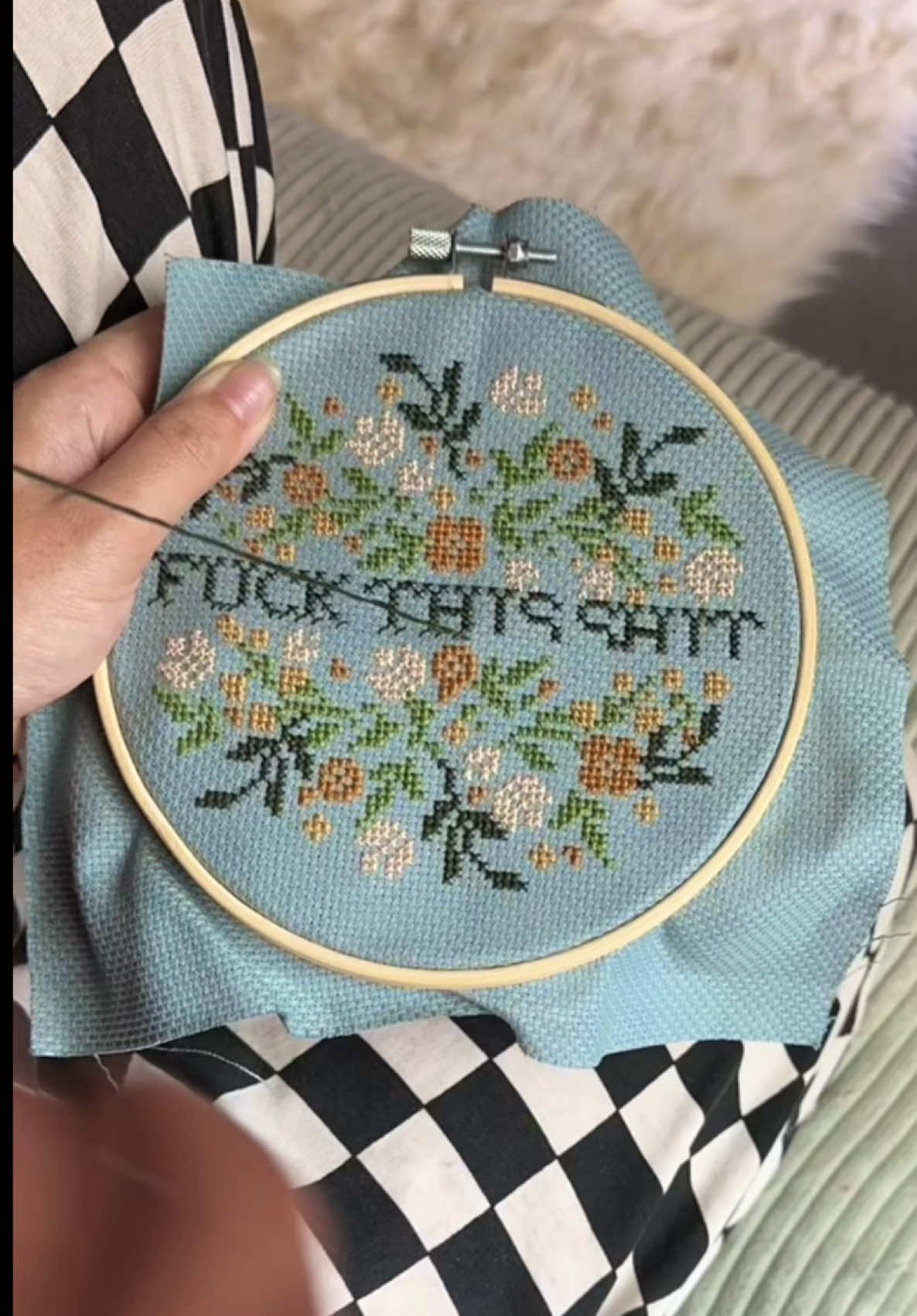 A post by @taybeepboop on TikTok caption: Took me many days to finish this masterpiece (because it was my first time cross-stitching!), the entire time living through construction, and on the day I finished I was surrounded by the beautiful sound of it 