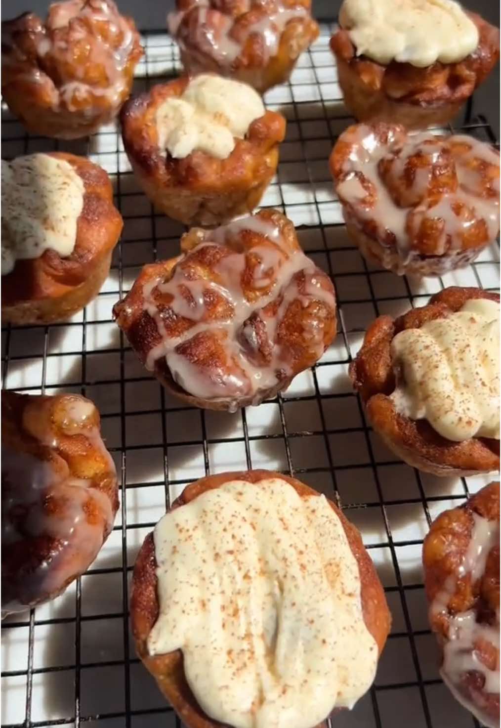A post by @_lacebakes_ on TikTok caption: Mini Cinnamon Roll Focaccias 🤎 Makes 19 Ingredients: 1x batch same-day focaccia dough (same-day recipe is pinned at the top of my page here or page 22 in my cookbook).  3-4 Tbsp (45-60g) butter, to brush tins brown butter cinnamon sugar: 1/2 cup (115g) melted salted butter, browned 1/2 cup (100g) light brown sugar  1.5 Tablespoons ground cinnamon  1/4 tsp vanilla extract •mix all together once butter has been browned whipped cream cheese frosting: 4 Tbsp (60g) salted butter, softened 7oz (200g) cream cheese, room temp  1 1/8 cup (140g) powdered sugar  1/2 tsp vanilla extract  3 Tbsp (45ml) heavy cream (double cream) •whisk everything but the cream until light and fluffy, about 2-3 minutes. Drizzle in the cream while still whisking until thick and velvety, about 1 minute. Decant into a piping bag. Cinnamon glaze: 1 cup (125g) confectioners sugar 1/8 tsp cinnamon 2 Tbsp milk (plus more if needed)  1/4 tsp vanilla extract •whisk all together until smooth Method: 1. Mix up the dough and perform the stretch & folds as normal  2. After proofing in bowl, divide into 50g dough portions on a buttered work surface. There should be about 19 pieces. 3. Place each into a buttered muffin tin  4. Cover and proof for about an hour. They should have risen to nearly the top of the tin.  5. Brown the butter and mix the cinnamon sugar mixture. When dough has finished rising, top each portion with 2 teaspoons of the mixture and dimple in.  6. Bake at 220C/430F for 16-18 minutes on lowest rack until golden. If baking two trays at a time, bake one on bottom and one in middle and rotate midway through the bake 7. Choose frosting or glaze option and mix up while the focaccias are baking (instructions above). 8. If frosting, jab a hole into the middle of each (I use a plastic straw), swirl it around to create a hole in the muffin and pipe a bit of frosting inside before piping more on top. Sprinkle with cinnamon.  9. If glazing, just drizzle glaze generously over each and set aside to harden. Enjoy!  A few notes: You can choose to do half frosted and half glazed like I did here - just halve the quantities in the recipe (or do full amount if you like it extra glazed/frosted!). To make ahead: You can freeze these (unglazed/unfrosted) in freezer bags, warm back up in the oven or air fryer and then glaze/frosted when they’re warm again.  Sometimes I only want to do 12 of these (one muffin tin’s worth), so I’ll use the remaining portion of dough to make a small Sicilian style focaccia pizza.  You can use regular butter without browning it first but you’ll get more complex caramel notes in the filling if you brown the butter first! It’s worth the extra effort… If you’ve never browned butter before, you essentially want to melt it down over a medium high heat and then simmer it, stirring every 30 seconds or so to ensure the butter isn’t sticking/burning on the base of the pan.  You’ll hear the bubbles from the butter sizzle as the water evaporates off of it but suddenly the butter will go quiet and start foaming up. Once this happens, look at the colour of the foam…you’ll start to notice lightly browned specks in the butter. Give the butter another good stir and remove from the heat. The butter should be a lovely golden brown (not dark brown - be careful as it can burn quickly!)… #focaccia #breadtok #focacciatok #cinnamonrollfocaccia #cinnamonbunfocaccia #cinnamonbuns #cinnamonroll 