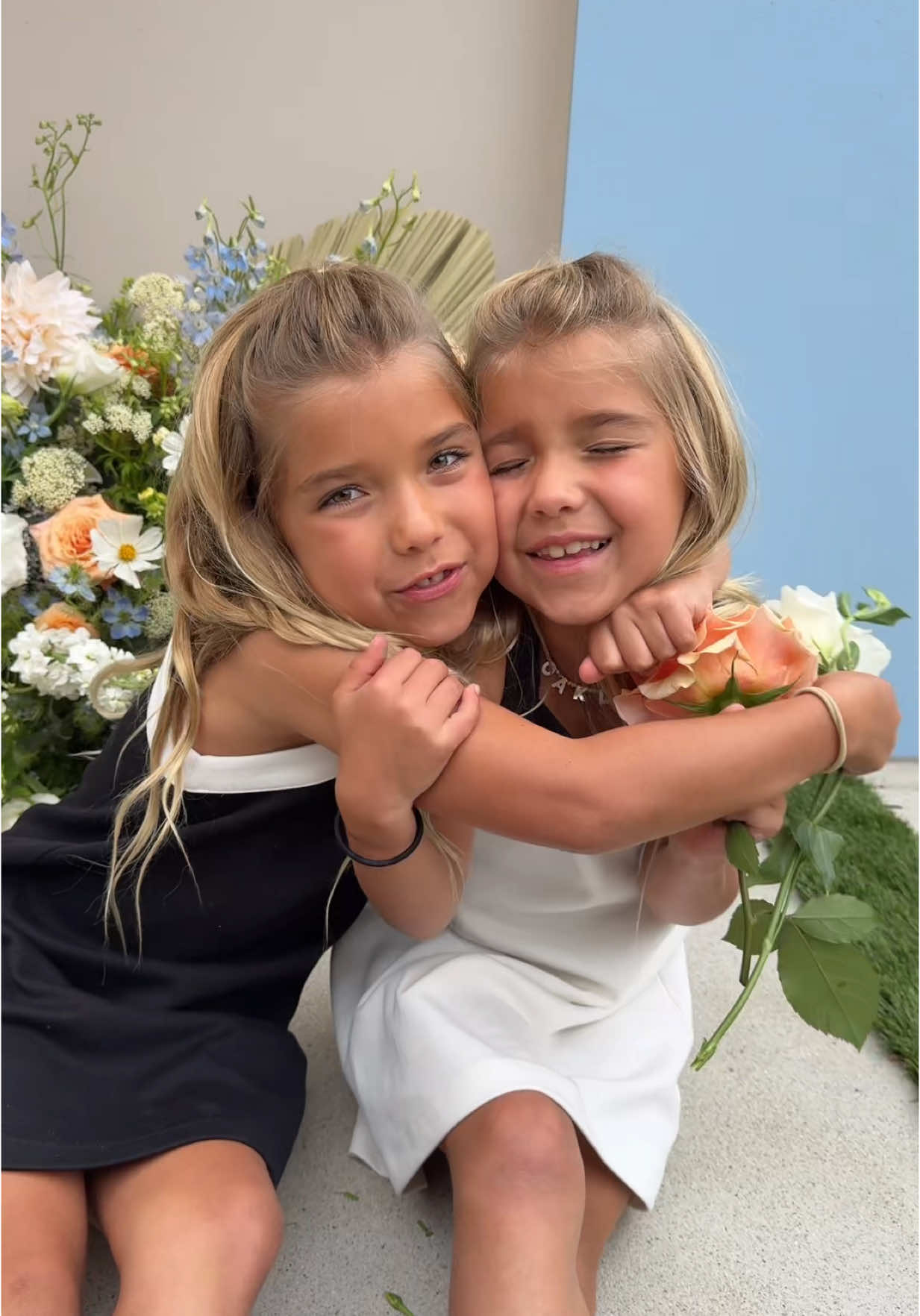 A post by @kylerandmad on TikTok caption: Who needs a flower?  🩷, Taytum & Oakley