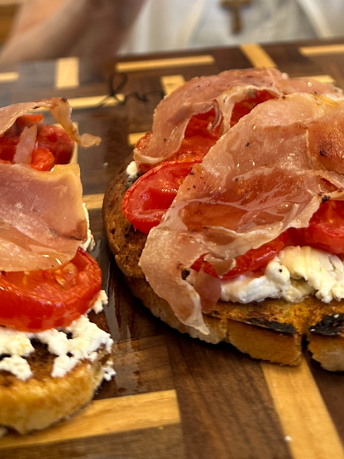 A post by @giallolovesitaly on TikTok caption: ✨ Quick, crispy, and loaded with flavor!😋❤️ This roasted feta & tomato bruschetta topped with crunchy prosciutto is your next appetizer obsession🥖🍅 Try it at home!🧀🥓 @nonnasilviofficial Ingredients: Bread (for 4 slices) Olive oil, to taste 1 cup feta cheese (200g) 1 cup cherry tomatoes (200g) 3.5 oz sweet prosciutto (100g) #giallolovesitaly #bruschetta #cheese #foodtok