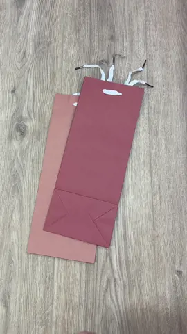 A post by @beeandblooms on TikTok caption: Got a small gift but only large gift bags? Here’s a trick to turn those bags into a perfect little gift box! Follow me on IG for more #beeandbloomswraps #wrappinggifts #giftwrapping #wrappinghacks 