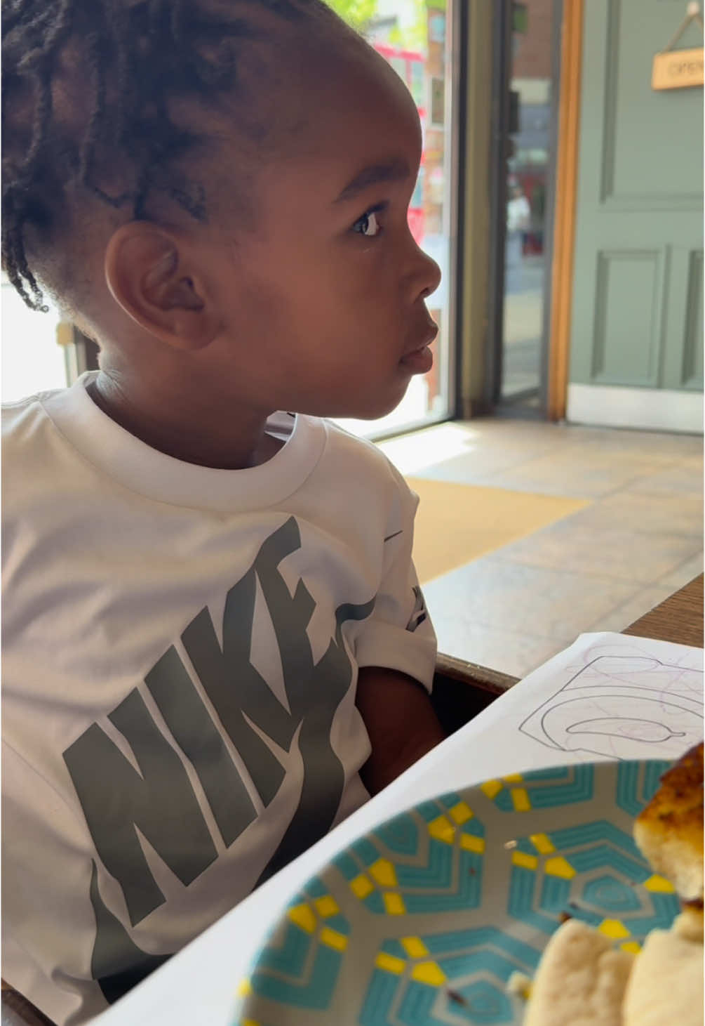 A post by @raisingzion1 on TikTok caption: Side eye of doom👀🤦🏿‍♂️ #toddlertok #toddler #cutetoddler #cute #football #footballtraining #newborn #newbornbaby #funnybaby #funnybabyvideos #funny #funnyvideos #broski 