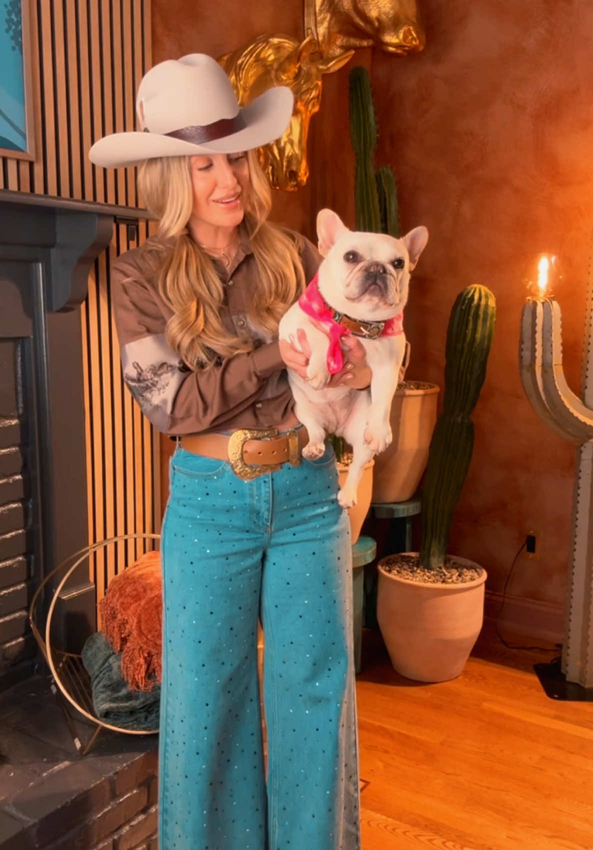 A post by @laineywilson on TikTok caption: Hippie, we ain't in Nashville anymore 🌈✨ #SomewhereOverLaredo 