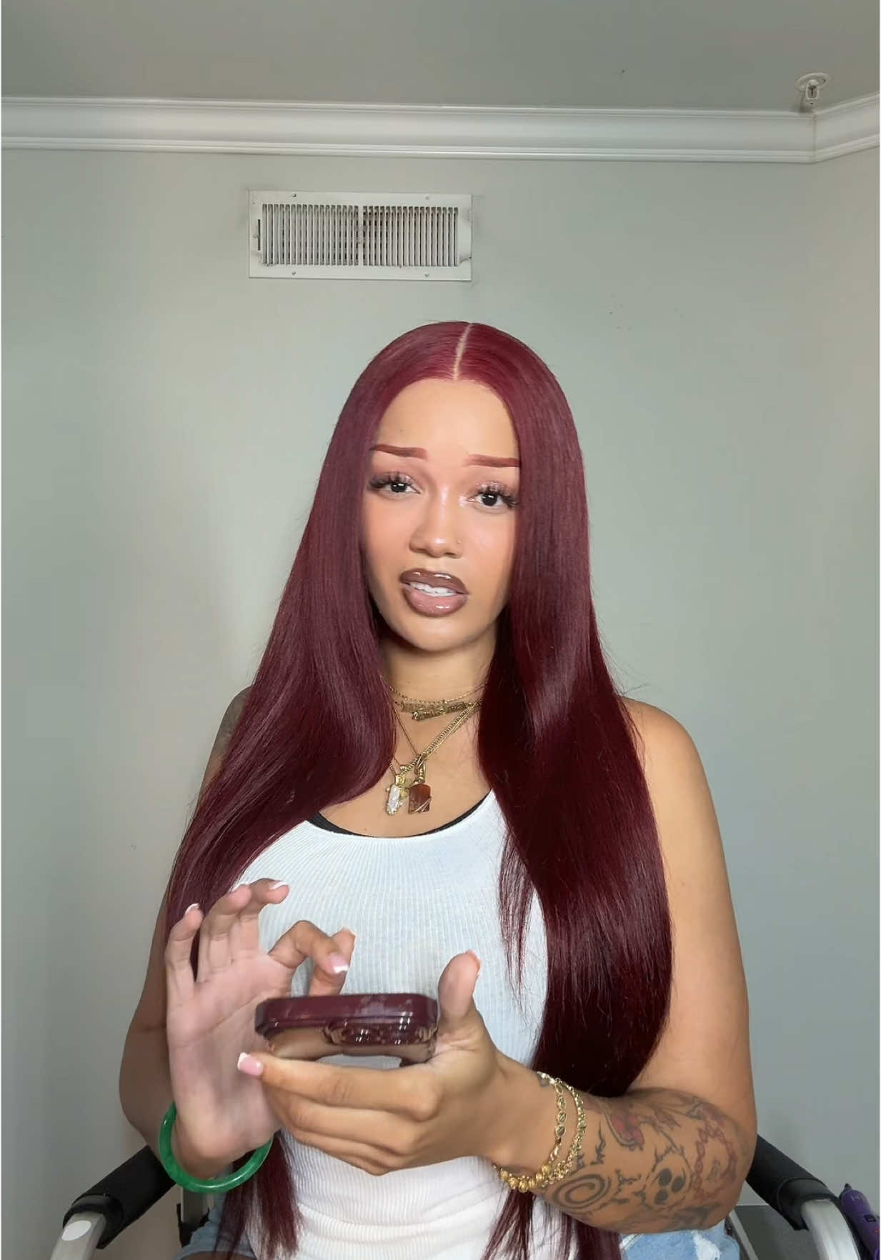 A post by @exactlye on TikTok caption: We love a dark red! @SeanChristopherFears 🔗 in bio to get the hair!